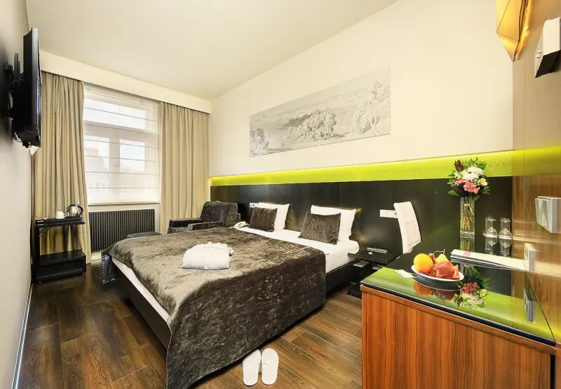 Hotel Ametyst Prague Deluxe room with optional fold-out armchair extra bed in dark style
