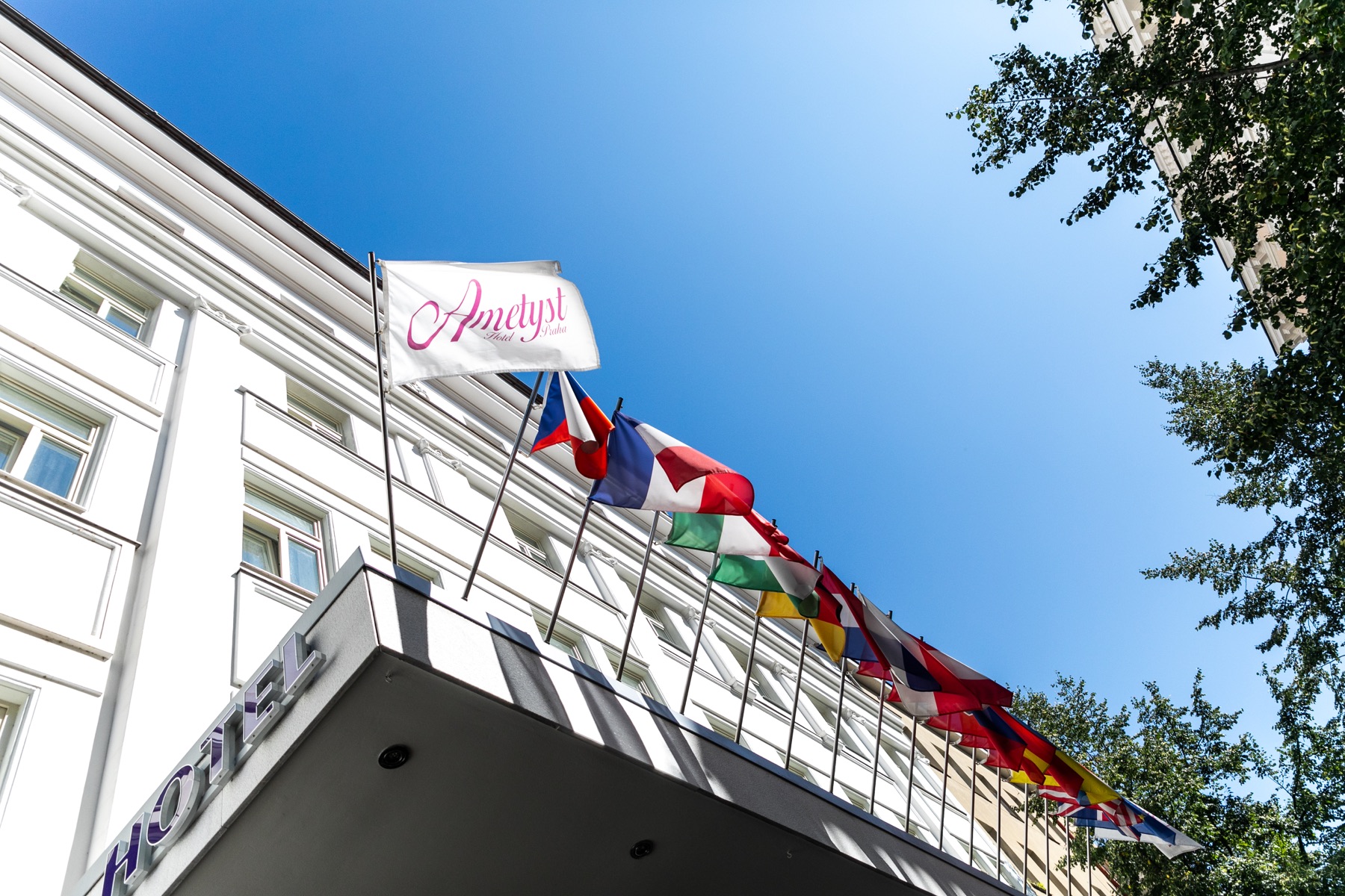 Hotel Ametyst Prague facade with flags